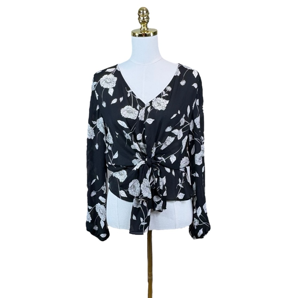 Woman’s Maurices lightweight black and white floral wrap tie top size M
